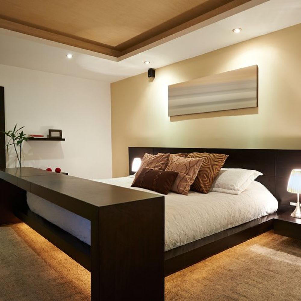 <span class="uk-h4">Image is of a bedroom with smart lighting under the bed and on the ceiling.</span>