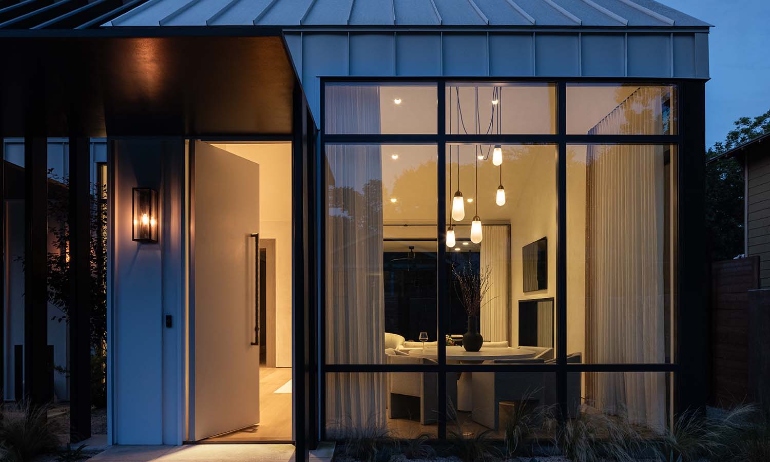 lutron lighting in a small home with floor to ceiling glass windows